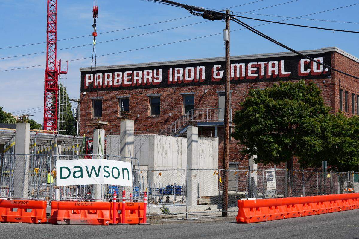 The first building is under construction on June 16 as part of the eight-block Old Town District redevelopment plan.