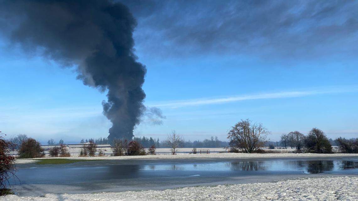 Smoke rises near Custer after a Burlington Northern Santa Fe train derailed Tuesday, Dec. 22.