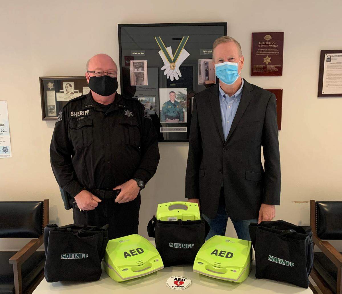 The Whatcom County Sheriff’s Office announced Wednesday, Oct. 28, that it has received a donation of 65 AEDs from Bryron Sprague in the memory of his father, Seattle Fire Department Deputy Chief Al Sprague Sr. The total value of Sprague’s donation is approximately $75,000. Sprague, right, is pictured with Sheriff Bill Elfo.