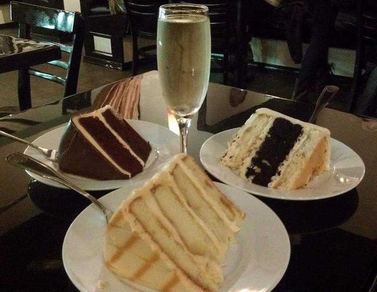 Pure Bliss Desserts in Bellingham offers Champagne and cakes. Clockwise from top: slices of coconut craze, salted caramel, and red velvet.