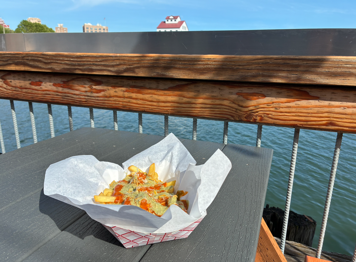 The butter paneer poutine from Simmering Tava’s food truck is pictured at Beach Cat Brewing’s Bellingham location.