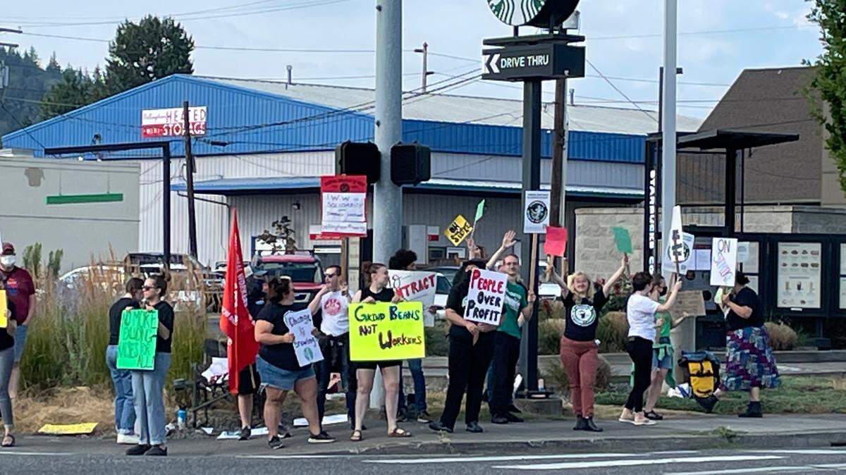Starbucks workers stage a one-day walkout of the Bellingham, Wash., store on the corner of King and Iowa streets in 2022. Workers recently formed a union at the store and are seeking a contract with the company.