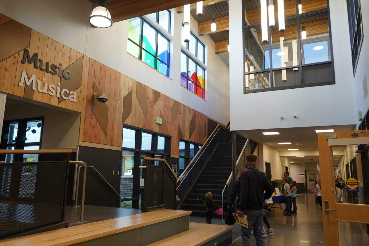 Lights illuminate the main entrance hallway at Sunnyland Elementary School at a public open house for the new school Thursday, Sept. 22, in Bellingham.