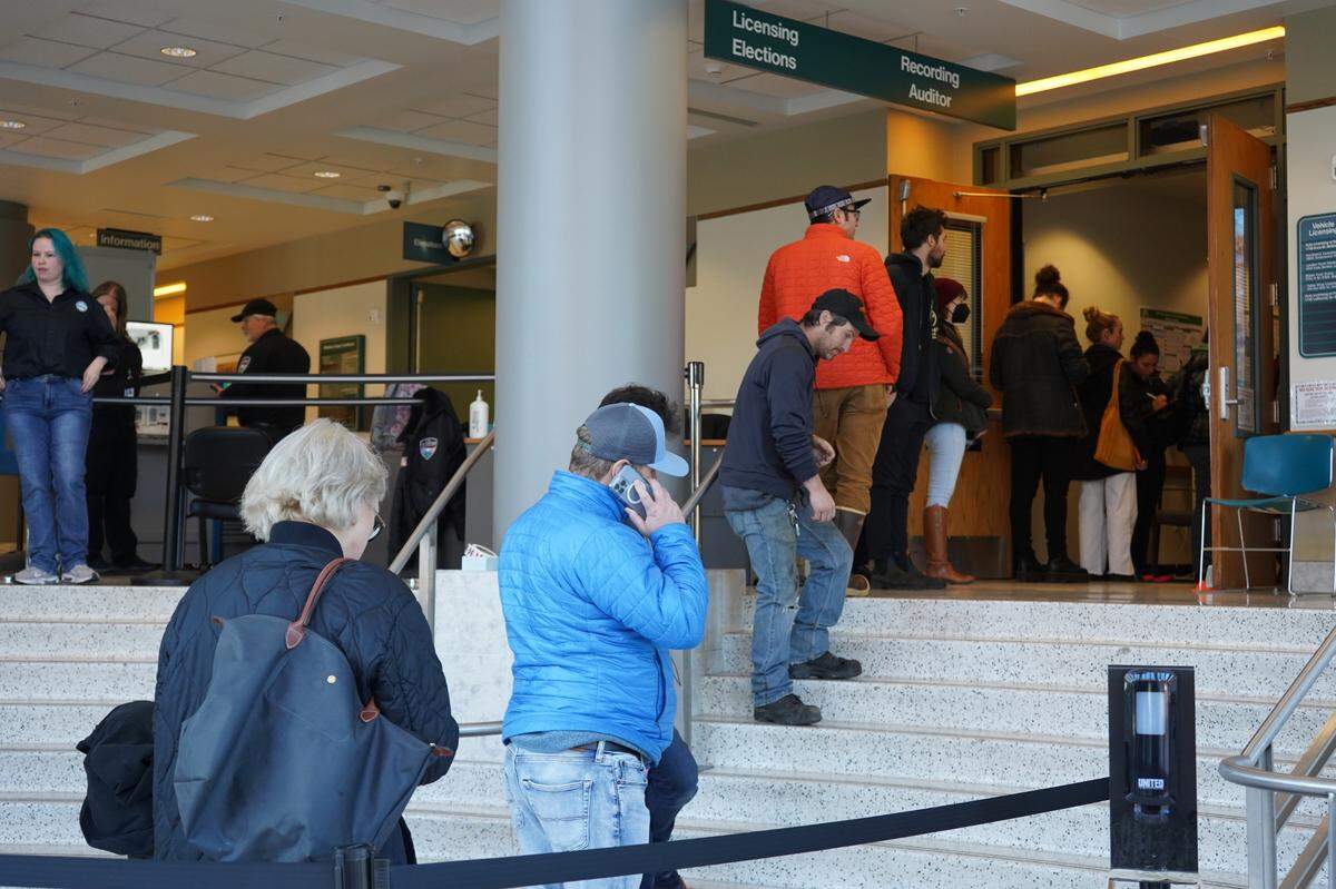 Whatcom County voters wait in line to vote in person at the Whatcom County Courthouse on Election Day, Tuesday, Nov. 8, in Bellingham.