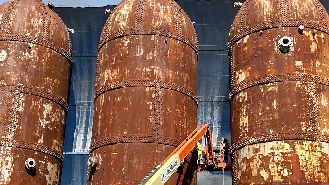 Workers from Purcell Painting and Coatings of Tukwila begin work on the six iconic digester tanks, known locally as the “rocket ships,” at the former Georgia-Pacific paper mill in the waterfront in Bellingham, Wash., on Friday, March 29, 2024.