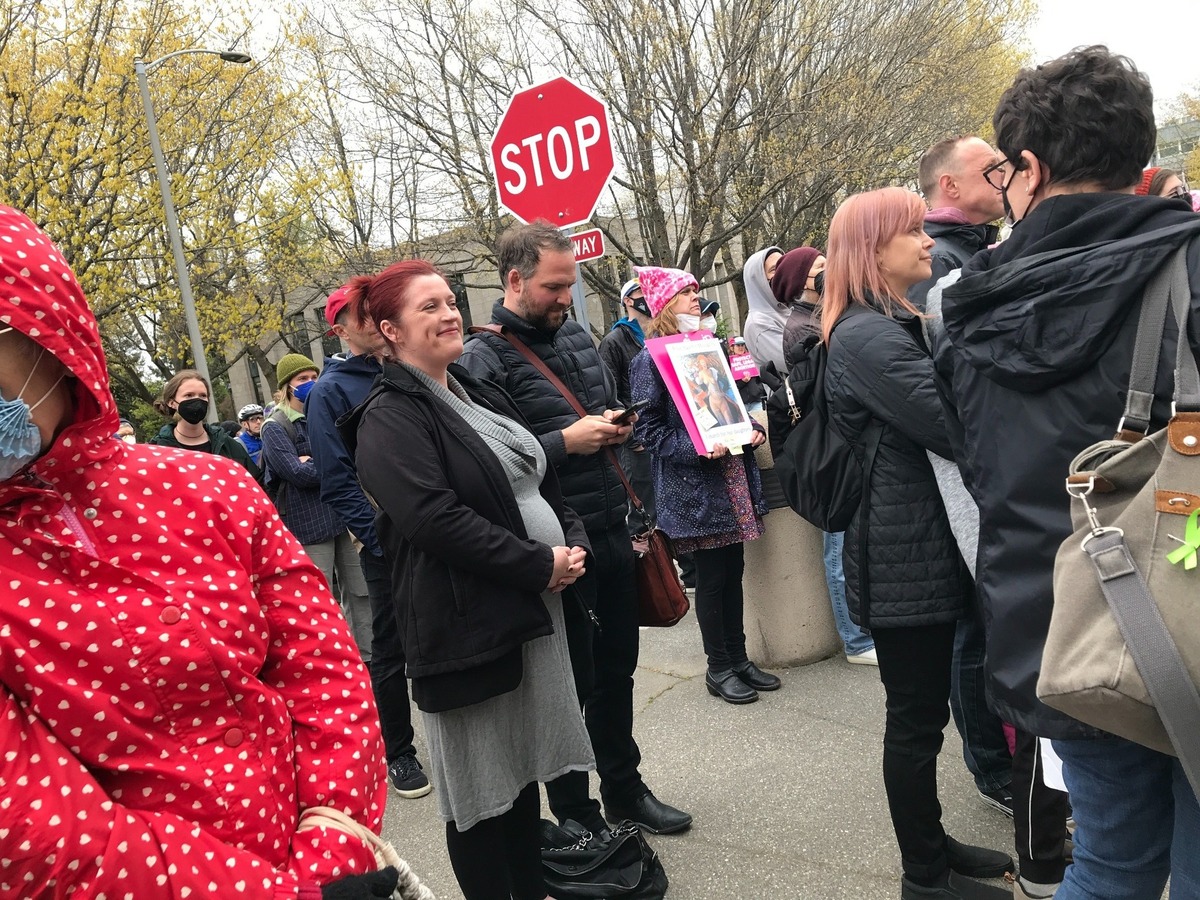 Bellingham City Council member Hollie Huthman, center, attends a rally in support of the 1973 U.S. Supreme Court ruling in Roe v.s Wade that ensured abortion rights for women on Tuesday, May 4, at the Whatcom County Courthouse in Bellingham. Huthman told the crowd that she was glad to have had the choice and support to continue her pregnancy. The Council approved a three-month absence for Huthman Monday, May 9, after she gave birth earlier that day.