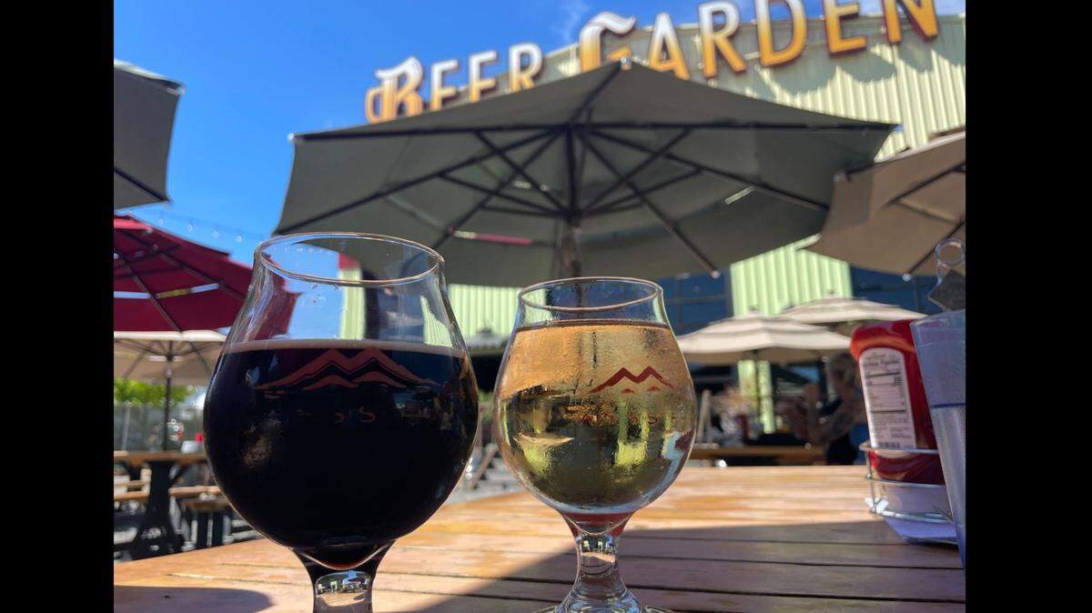 Twin Sisters Brewing Company’s Lullaby Imperial Stout and rotating hard cider at the brewery’s outdoor beer garden in Bellingham, Wash. on Aug. 4, 2023.