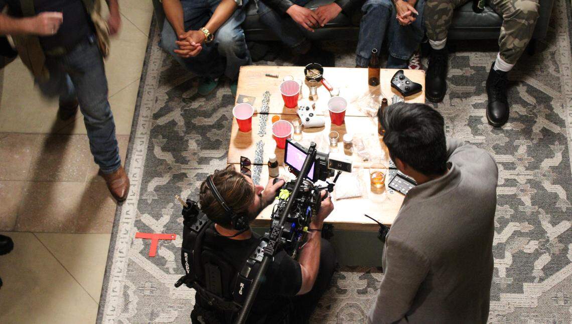 The crew of “Love and Other Crimes” films a party scene April 22, 2026, at the Lake Whatcom Manor in Bellingham, Wash.