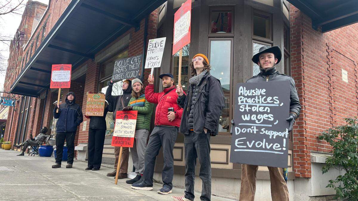 A group of former employees of Evolve Chocolate + Cafe picketed outside the business with supportive community members on Jan. 30.