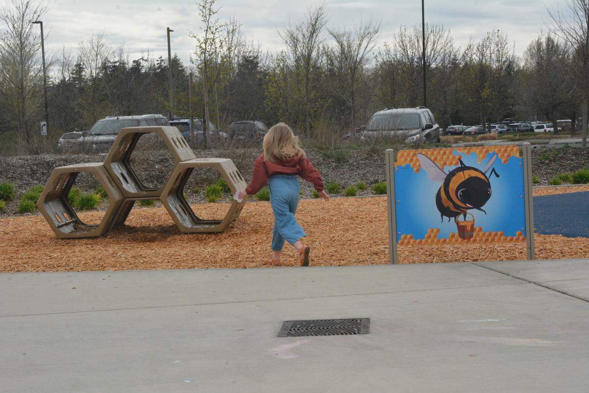 Lottie Watson, 6, plays on a play structure shaped like a honeycomb at Cordata Park on April 26,, 2023.