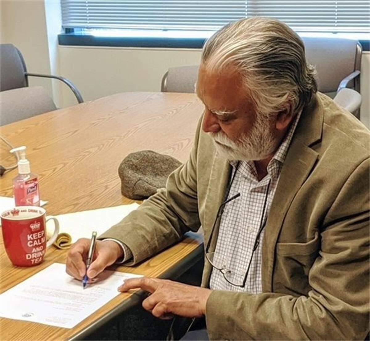 Whatcom County Executive Satpal Sidhu signs the county’s application to move to Phase 2 of “Safe Start Washington” on Tuesday, June 2, in Bellingham. It was sent to the Washington State Department of Health for approval by the Secretary of Health. The step will allow more businesses to open and ease social distancing requirements put in place for the COVID-19 pandemic.