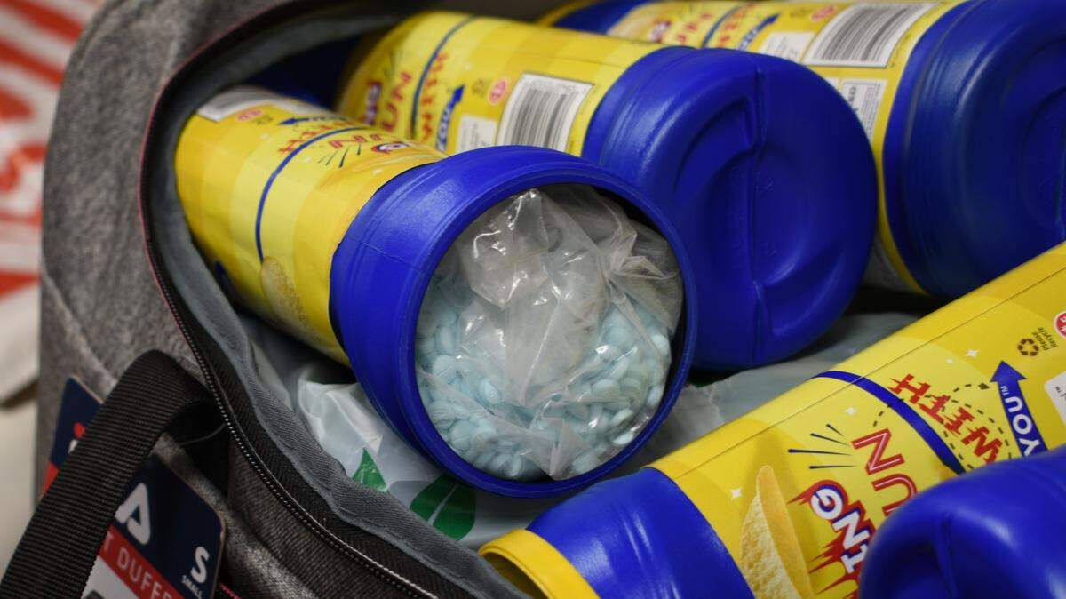 Some of the approximately 91,000 fentanyl pills that were delivered to Bellingham in 2022., according to Homeland Security Investigations. Approximately 10 kilograms of fentanyl was concealed within cardboard boxes and potato chip containers found in a duffle bag by Homeland Security Investigations special agents.The Bellingham City Council voted to criminalize public drug use Monday night, April 10, paving the way for the rule to take effect in 15 days.