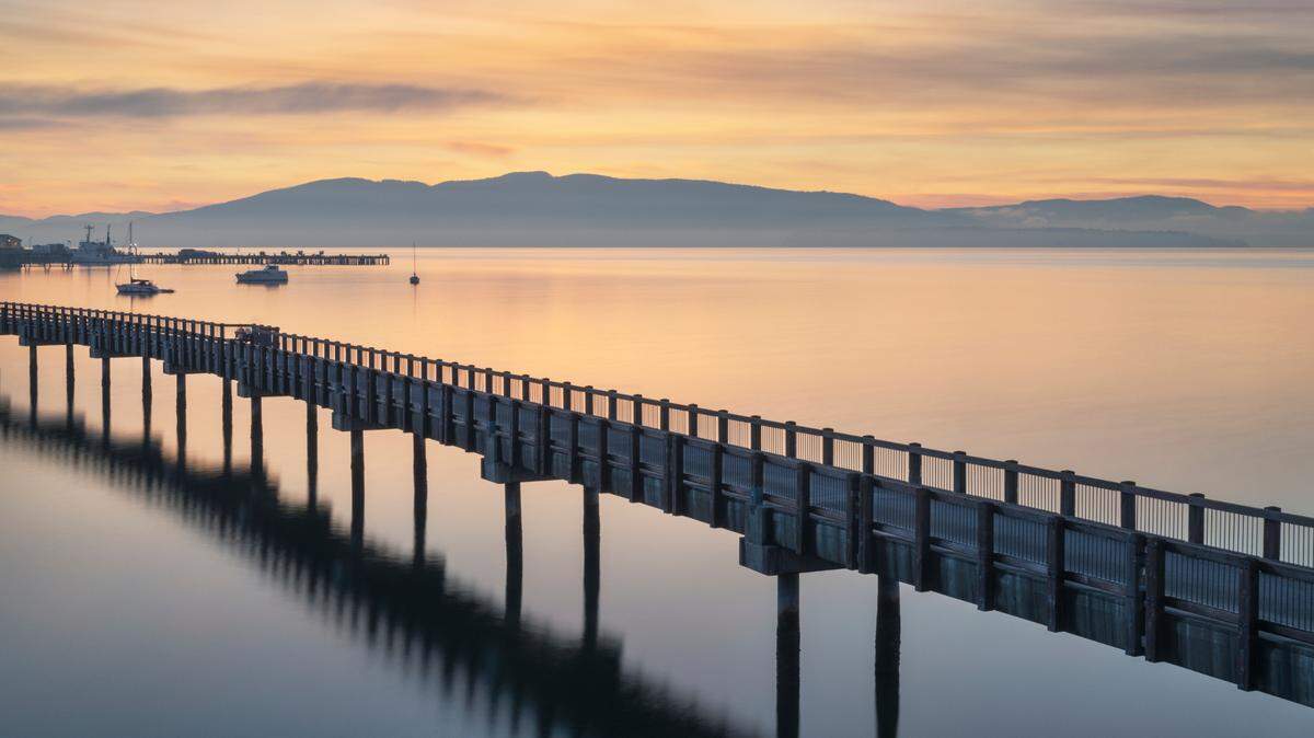 Taylor Dock Boardwalk during twilight afterglow at Boulevard Park in Bellingham, Wash.