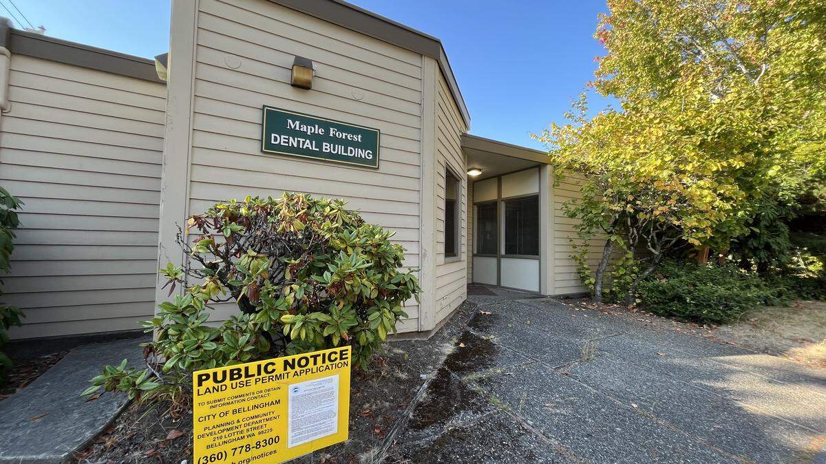 A development notice is posted in front of the Maple Forest Dental Building at 1101 N Forest St. on Sept. 18 in Bellingham. There’s a proposal on the table to demolish the building and replaced it with a 36-unit multifamily residential housing project.