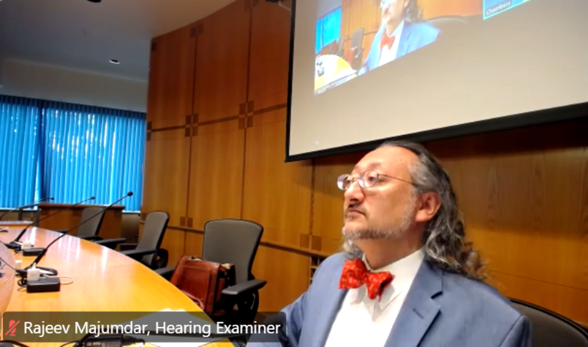 In a screenshot from a livestream broadcast, Whatcom County Hearing Examiner Rajeev Majumdar considers a conditional-use permit application for a campground in Point Roberts in a hearing at the County Courthouse in Bellingham on July 1.