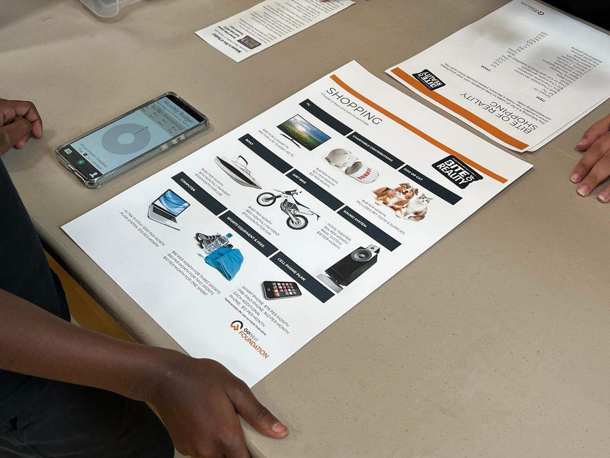 A student at Shuksan Middle School participates in the Bite of Reality financial education event.