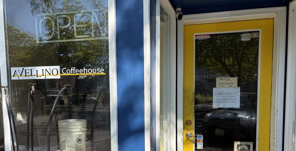 A sign posted on the front door of Avellino Coffeehouse at 1329 Railroad Ave. announces the business closed July 11.