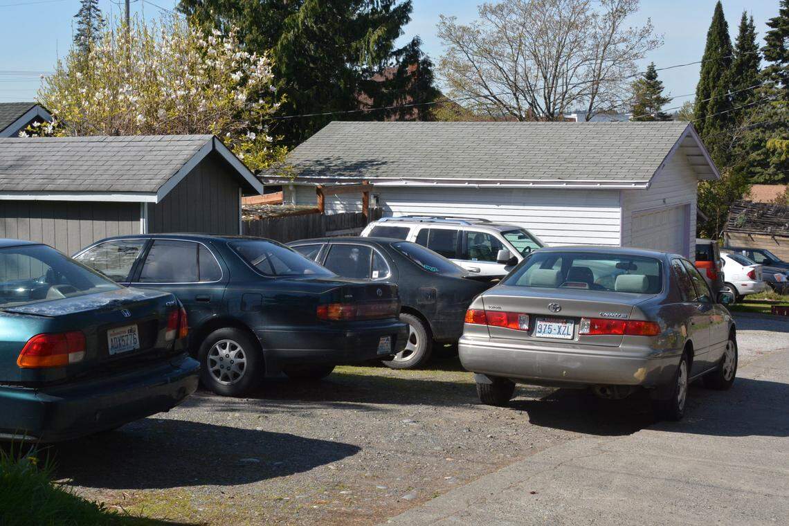 An alley off Franklin Street shows several cars behind a home. Neighbors said that streets and alleys in the neighborhood often are blocked, or access is limited, by parked cars, a possible safety issue if police or firefighters need quick access.