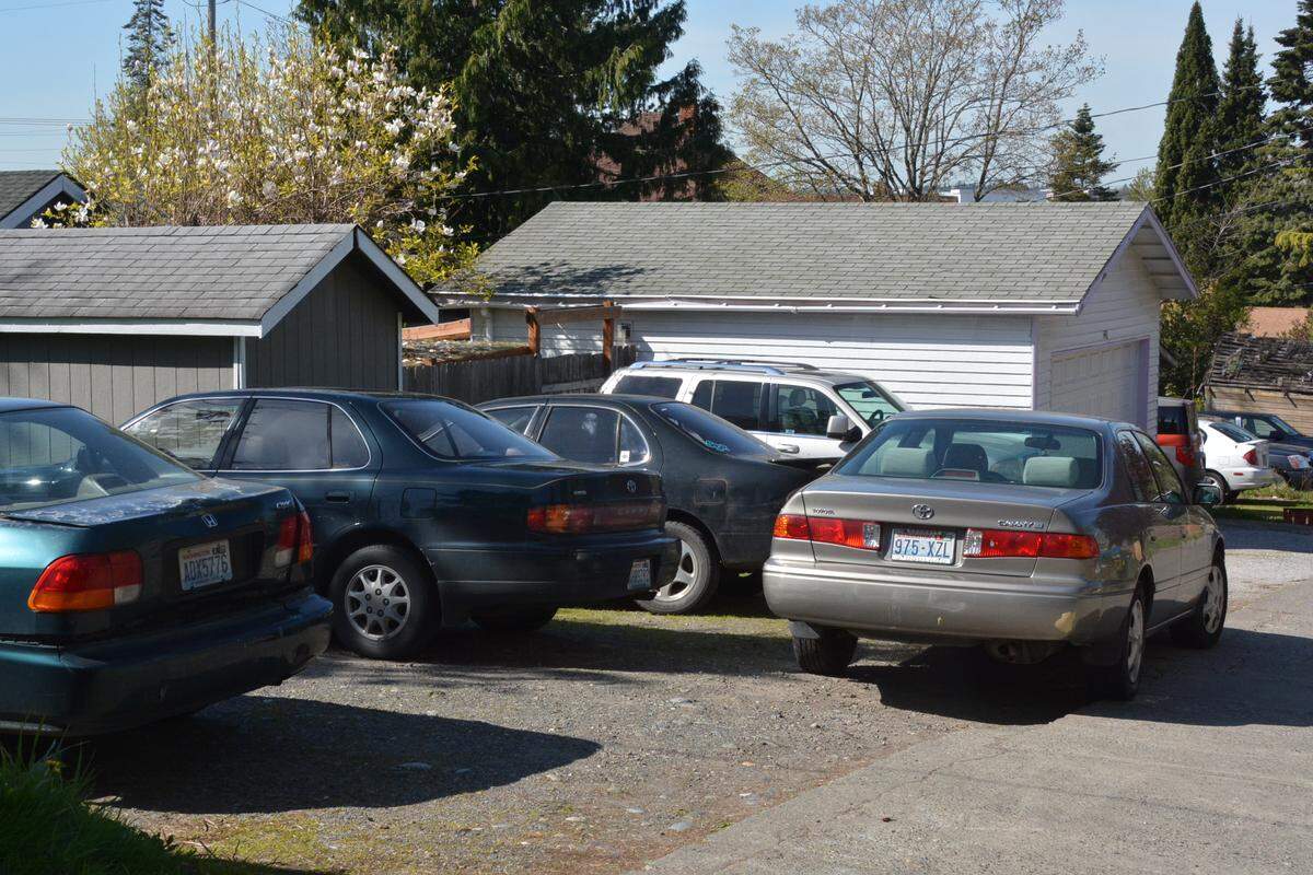An alley off Franklin Street shows several cars behind a home. Neighbors said that streets and alleys in the neighborhood often are blocked, or access is limited, by parked cars, a possible safety issue if police or firefighters need quick access.