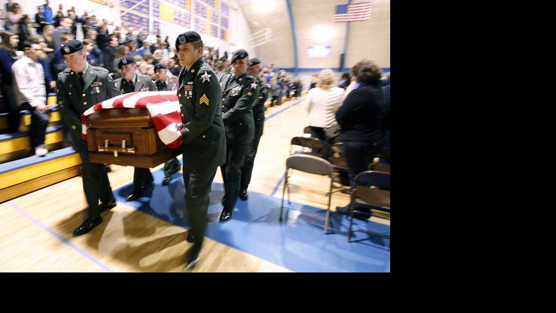 A Fort Lewis Honors team carries out the casket of U.S. Army Spec. Aaron Aamot at the end of a memorial service for Aamot in the Ferndale High gymnasium on Saturday November 14, 2009 in Ferndale. Aamot was killed Nov. 5, 2009 while serving in Afghanistan.