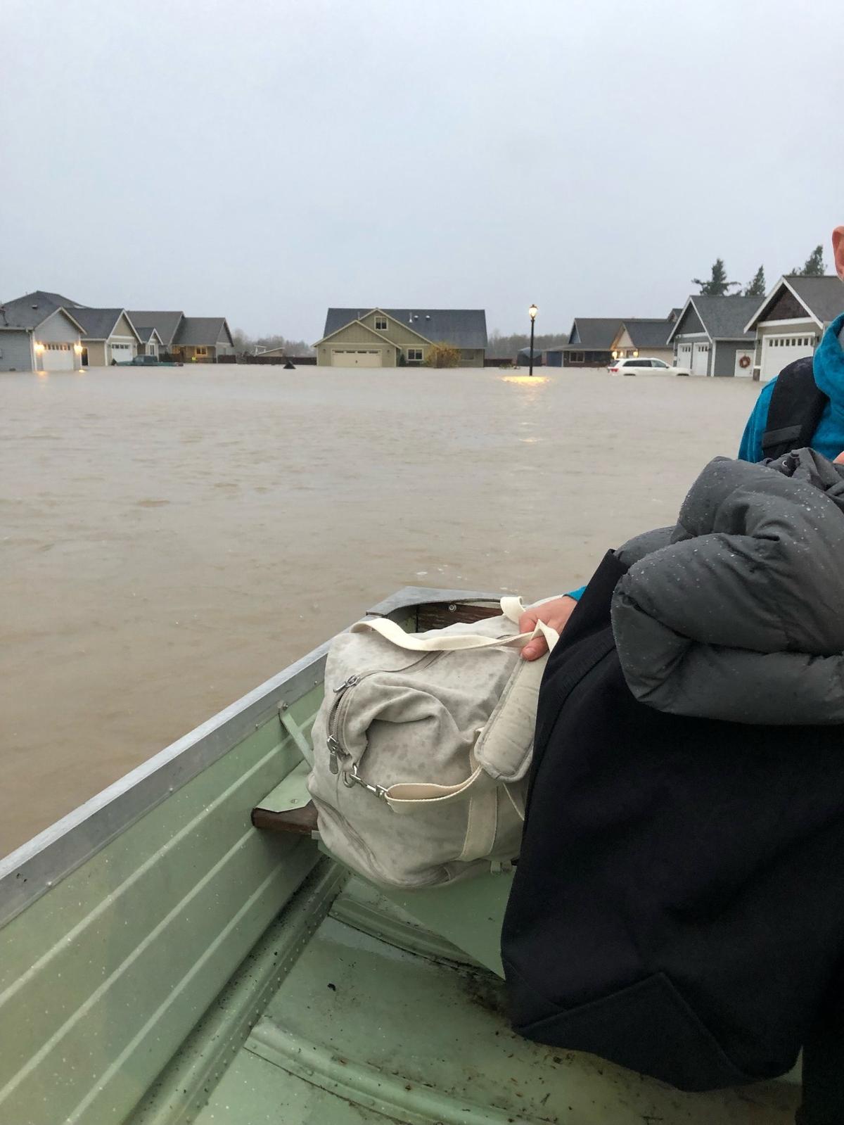 Marina Wiersma and her family are evacuated from their home in Nooksack using a neighbor’s boat during severe flooding in Whatcom County the week of Nov. 15.