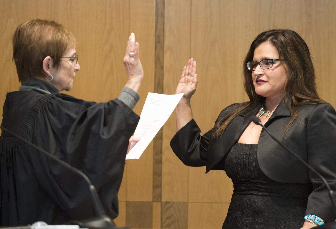 Raquel Montoya-Lewis, right, is sworn as a Whatcom County Superior Court judge in 2015 by retired state Supreme Court justice Bobbe Bridge.