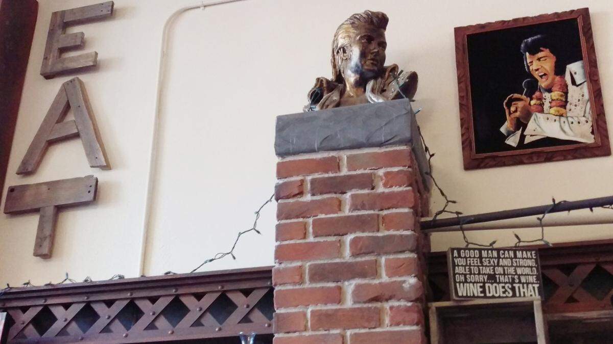 A velvet Elvis hangs on the wall alongside a bust of the King in 2016 at Cosmos Bistro, 1151 N. State St., in Bellingham. The restaurant, which opened in 2015, announced Tuesday, Feb. 21, that it will close Sunday, Feb. 26.