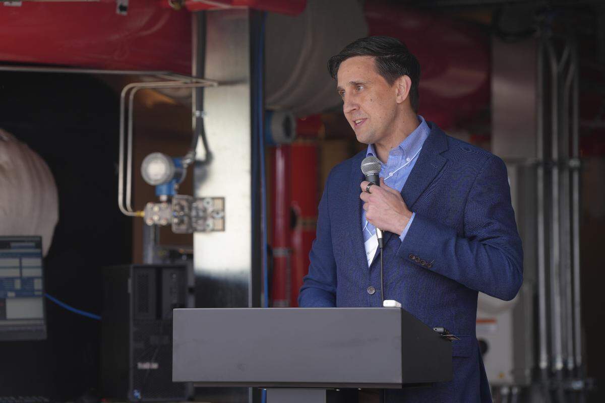 Washington state Rep. Alex Ramel, D-Bellingham, speaks May 29 at the ribbon-cutting ceremony for the new District Energy system on Bellingham’s downtown waterfront.