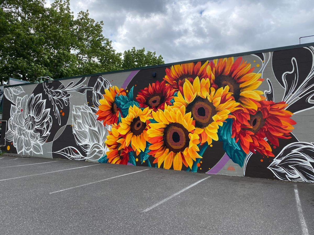 Emily Beaudoin of Calgary, Canada painted this sunflowers mural on the side of Greene’s Corner on James Street in Bellingham, Wash.