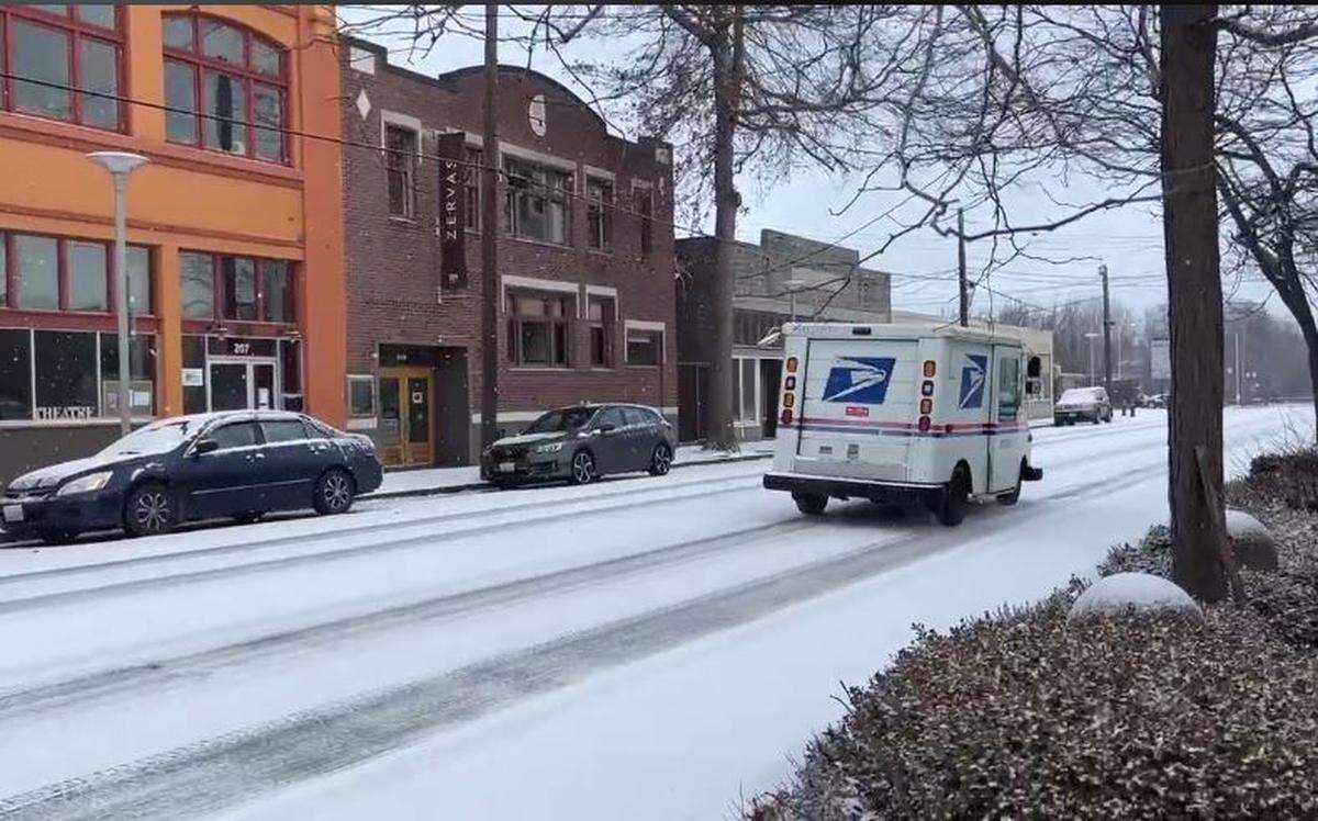 U.S. Postal Service truck is driven up Prospect Street in downtown Bellingham Sunday morning, Dec. 18.