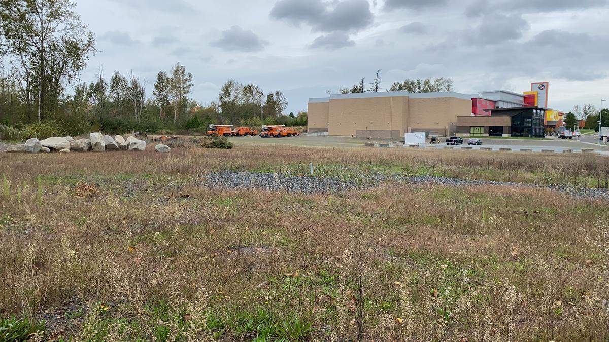 An empty lot beside the Regal Cinemas Barkley Village theater is the planned location for a new nature play park being built by the Barkley Company in Bellingham. The park is expected to be open by summer 2021.