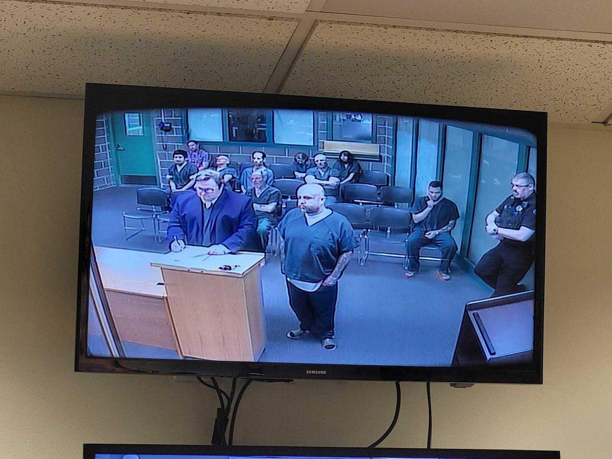 Angel Lewis Leffingwell, 38, of Everett (right), stands with his public defense attorney, Matthew Palmer (left), as he makes his first appearance in Whatcom County Superior Court Monday, March 18, 2024 in Bellingham, Wash. Leffingwell is accused of providing drugs to two other prisoners incarcerated in the Whatcom County Jail, resulting in one man’s death and another being hospitalized.