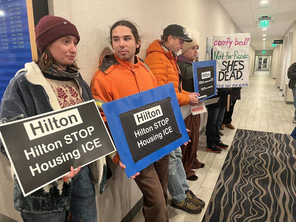 Dozens of community members gathered at the Hampton Inn Bellingham Airport on Friday night to demand that Hilton Hotels stop housing U.S. Immigration and Customs Enforcement (ICE) agents.