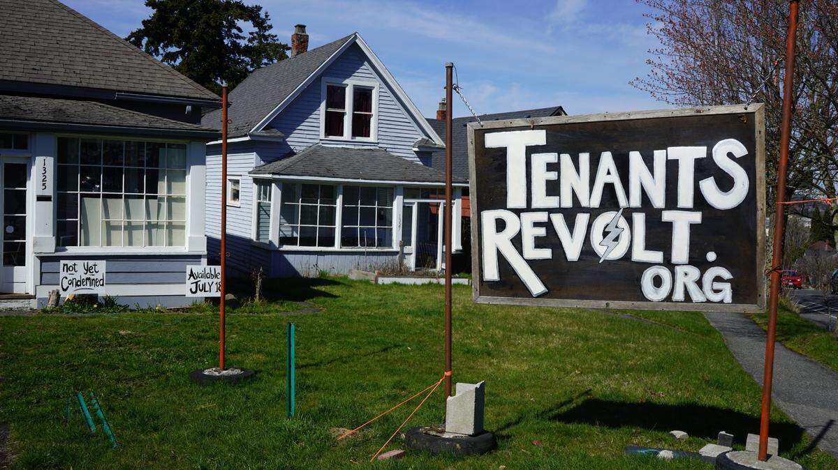 A Tenants Revolt sign is posted on the corner of Ellis Street and Potter Street on March 29, 2023, in Bellingham, Wash.