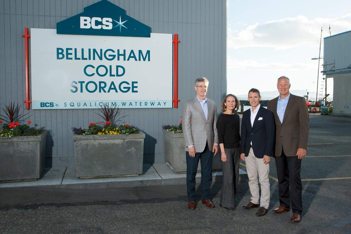 Stanley McCammon, president of Joshua Green Corporation, left, with Jane Talbot, Stowe Talbot and Doug Thomas. Joshua Green Corporation has become a majority owner of Bellingham Cold Storage, which has been in the Talbot family since 1946 and employs around 150 people.
