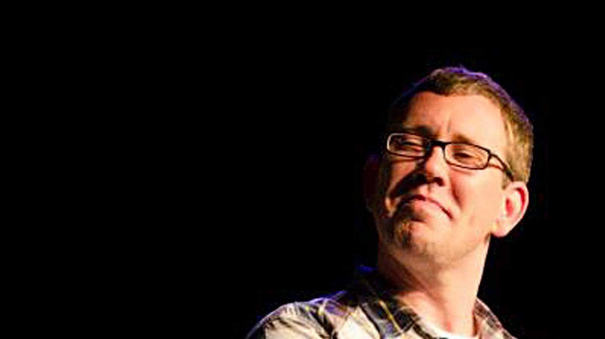 Galen Emanuele performing onstage. Emanuele is the founder of Shift Yes, which uses performance improv to help businesses.