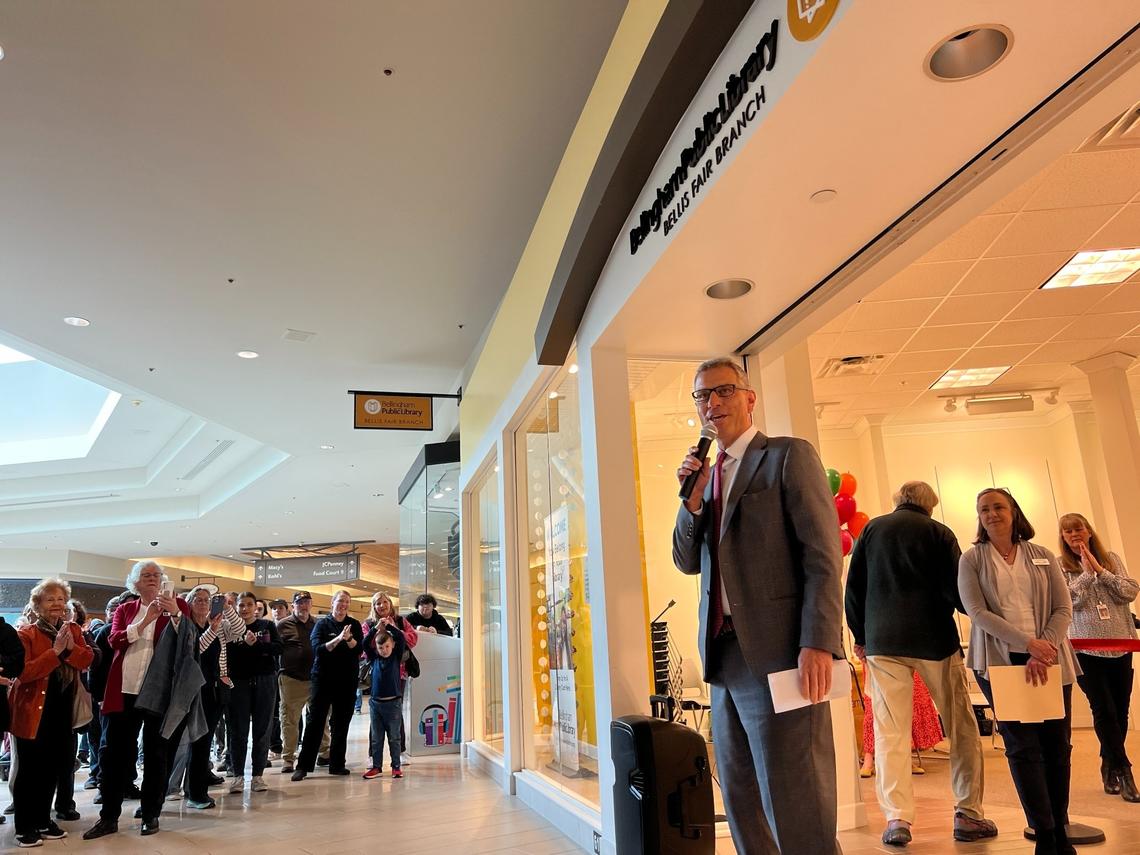 Bellingham Mayor Seth Fleetwood, center, addresses a crowd of about 200 people as the Bellingham Public Library opened its new branch at Bellis Fair mall on Wednesday, April 26. Library Director Rebecca Judd is second from right.