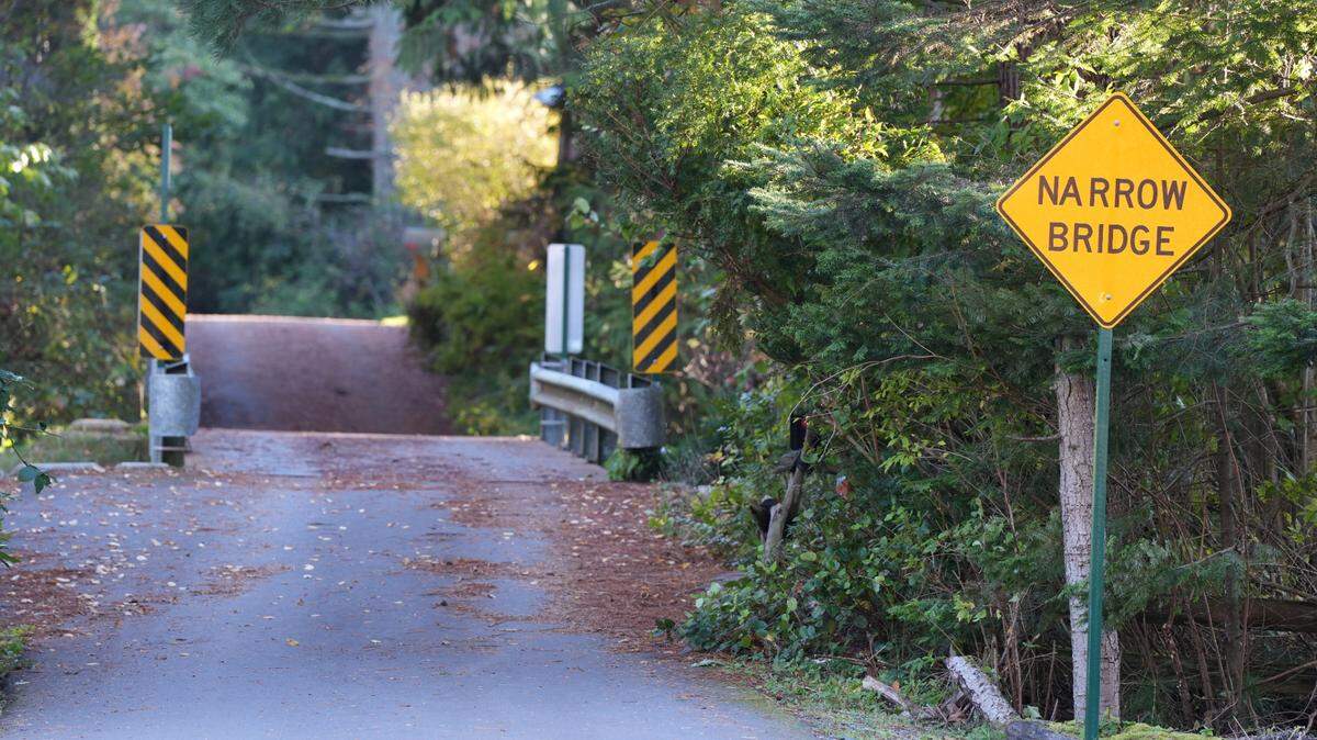 A “Narrow Bridge” sign is posted in front of the temporary bridge over Chuckanut Creek this month on 19th Street in Bellingham.