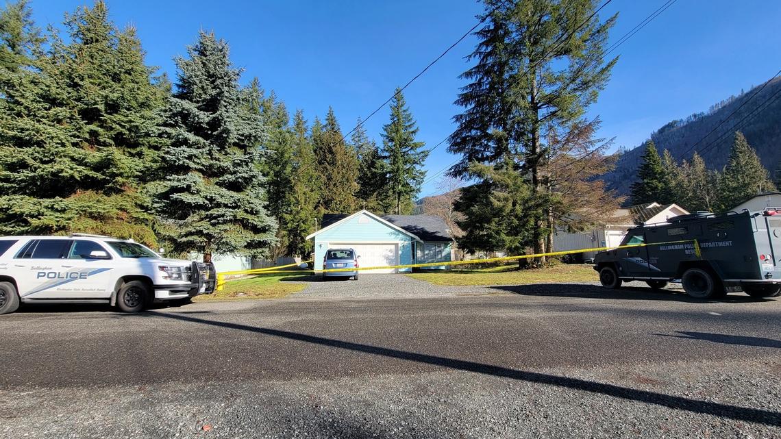 Crime scene tape and law enforcement vehicles remain on Green Valley Drive in Maple Falls, Friday morning, Feb. 11. Joel Berck Young, 60, was arrested on suspicion of two counts of attempted first-degree murder after he reportedly shot two Whatcom County Sheriff’s Office deputies in the head with birdshot as they tried to break up a dispute between neighbors Thursday, Feb. 10.