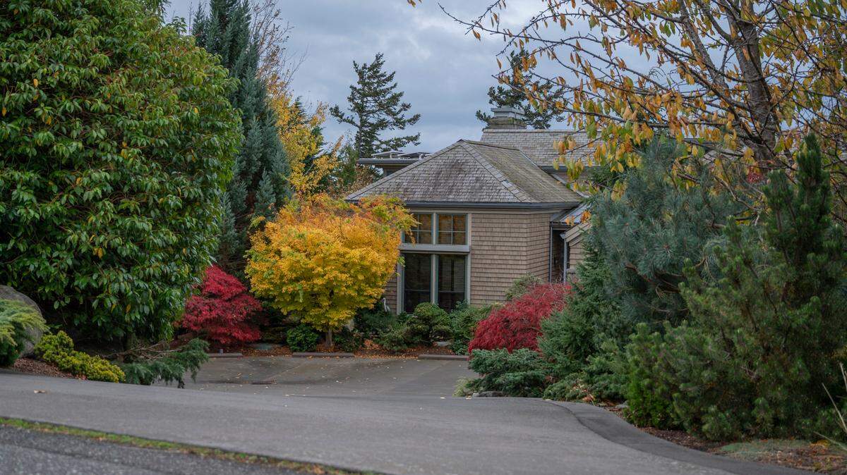 Obscured by landscaping and a slope, the front entrance to a house that recently sold for $7,310,000 is visible from the street in Bellingham’s Edgemoor neighborhood on Tuesday, Oct. 26.
