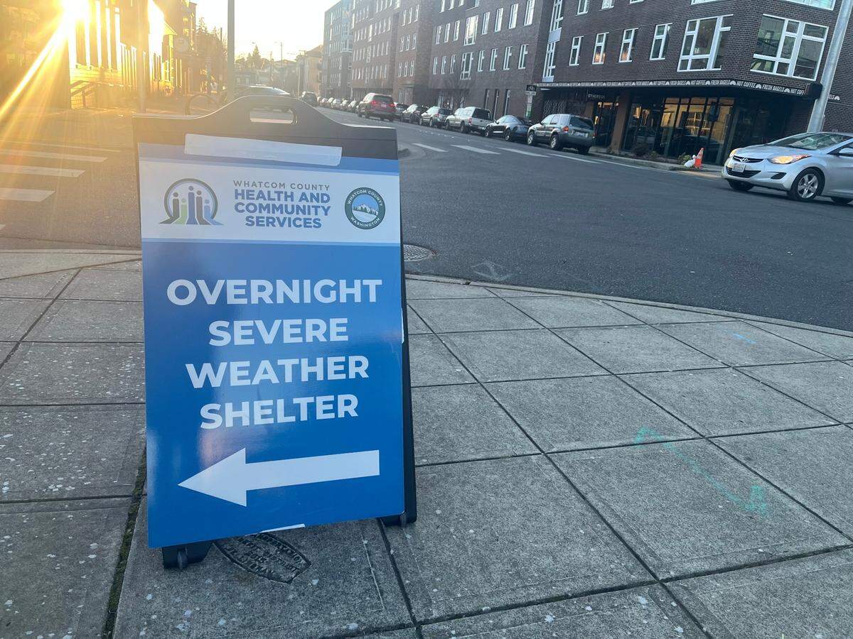 A sign is posted on State Street in Bellingham on Jan. 24, directing individuals to Whatcom County’s overnight severe weather shelter.