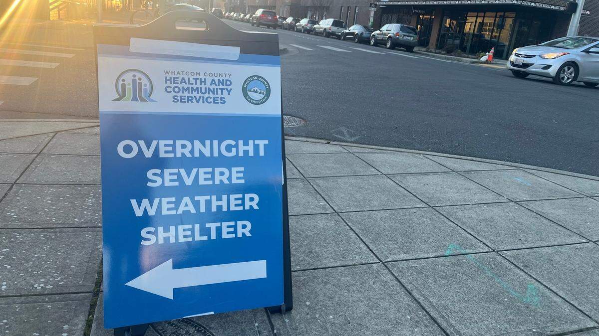 A sign on State Street in Bellingham directs individuals to Whatcom County’s overnight severe weather shelter, which operates from 4 p.m. to 9 a.m. when temperatures fall below 32 degrees.