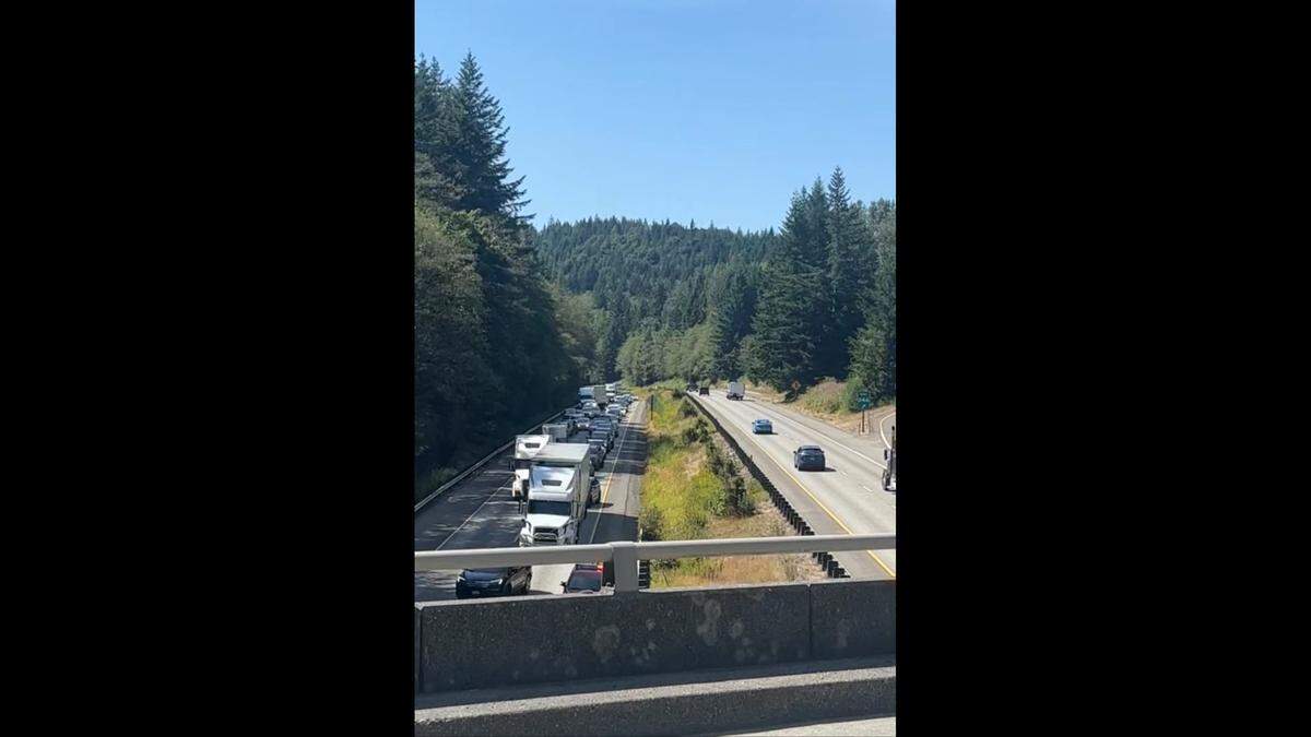 Traffic is at a standstill on I-5 south of Bellingham due to a roadside brush fire on July 27, 2023.