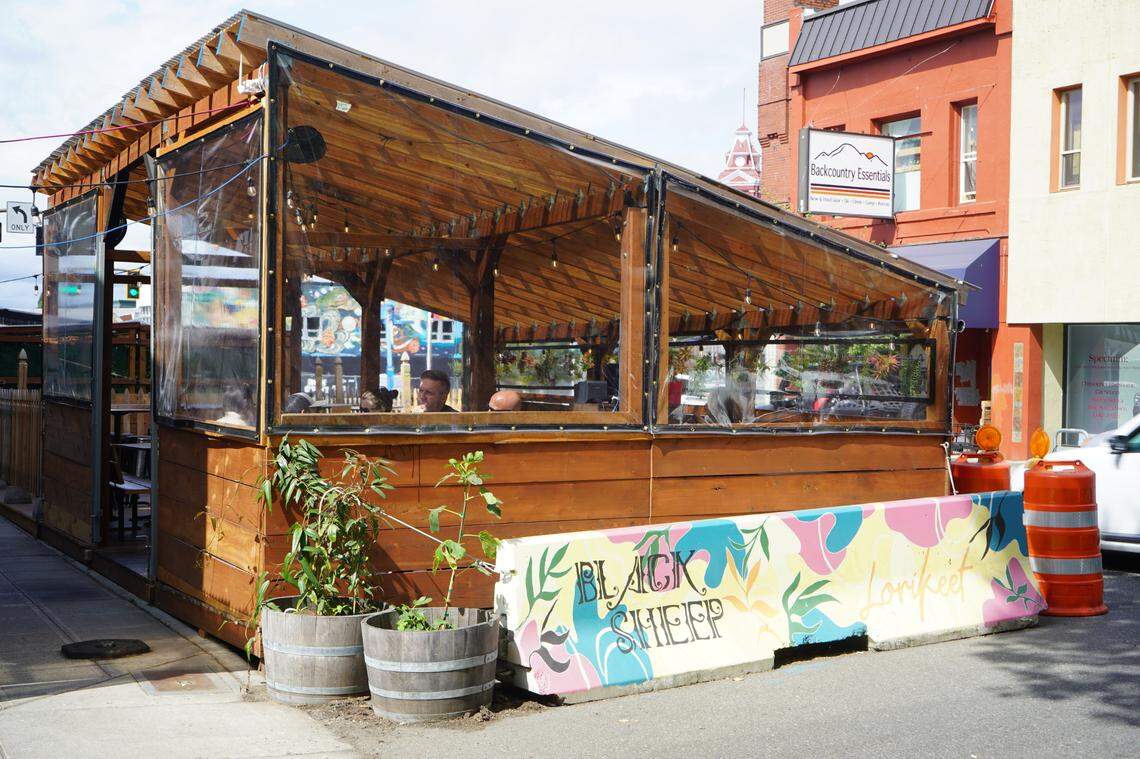 People enjoy outdoor dining at Black Sheep’s “streatery” on Friday, Aug. 26, in Bellingham.