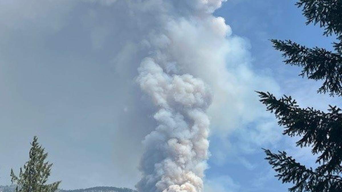 Smoke from the Ruby Fire is seen from the mountain village of Newhalem in southeastern Whatcom County on Monday.