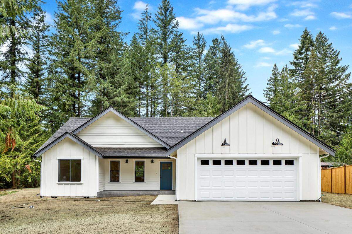 A home for sale at 401 Flair Valley CT in Maple Falls, Wash. by The Muljat Group.