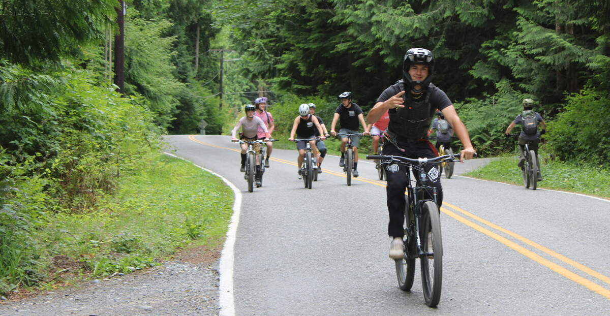 A group of bikers rides toward the Galbraith Mountain trails on Saturday.