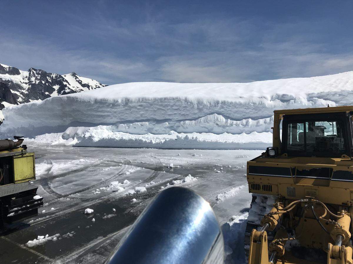 Washington State Department of Transportation crews work to clear the parking lot at Artist Point on Monday. WSDOT opened the final 2.7 miles of the Mount Baker Highway to Artist Point Thursday.