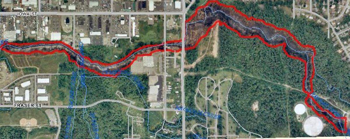 Red lines on a map with Woburn Street vertically in the center outlines the areas on Whatcom Creek damaged June 10, 1999, in the Olympic pipeline explosion.