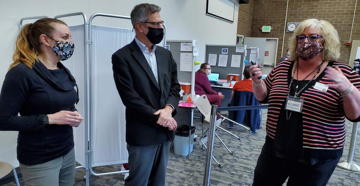 Bellingham Mayor Seth Fleetwood joins Whatcom County Health Director Erika Lautenbach Saturday afternoon, March 13, to tour the new Community Vaccination Center at Bellingham Technical College. Talking to them is Shanon Hardie, chief operation officer of Unity Care NW and co-chair of the Community Vaccination Center Steering Committee.
